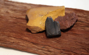Natural ochres and a piece of bark (eucalpytus tetradonta).